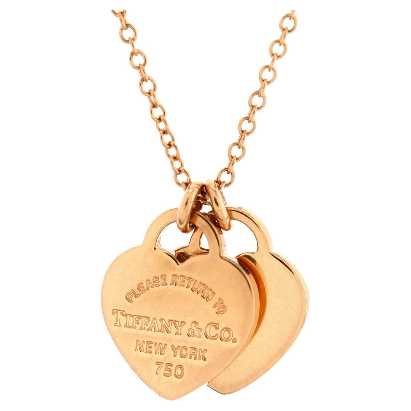 Elsa Peretti® Open Heart pendant in 18k gold with diamonds. | Tiffany & Co.